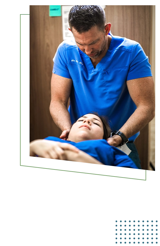 Chiropractor Dan Foss Examining Patients Neck
