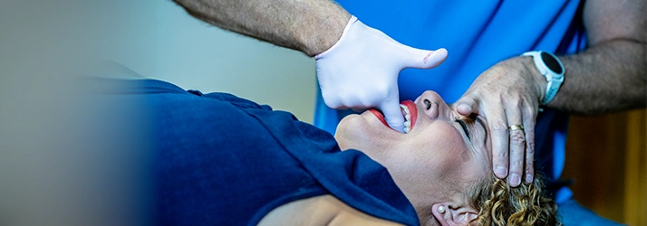 Chiropractor Dan Foss Performing Cranial Adjustment